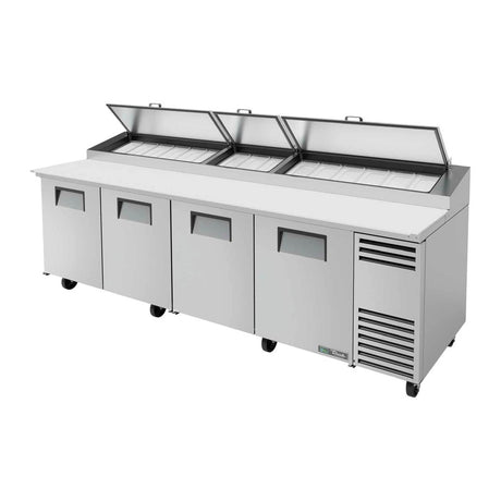 True TPP-AT-119-HC 119-1/4" 4-door pizza prep table with (15) 1/3 size pans, doors closed, lid open